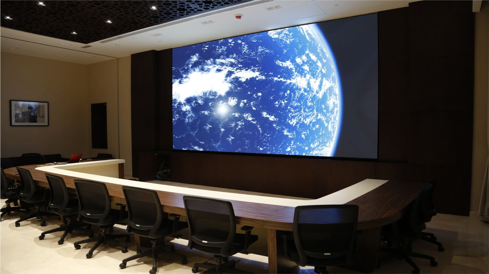 Boardroom with a seamless TRUE dvLED wall showing Earth from orbit