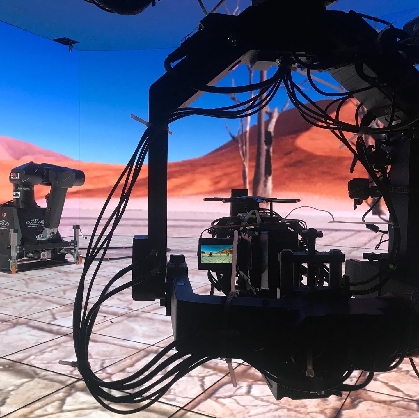 Camera robot in front of a TRUE dvLED virtual production volume at the One Location studio