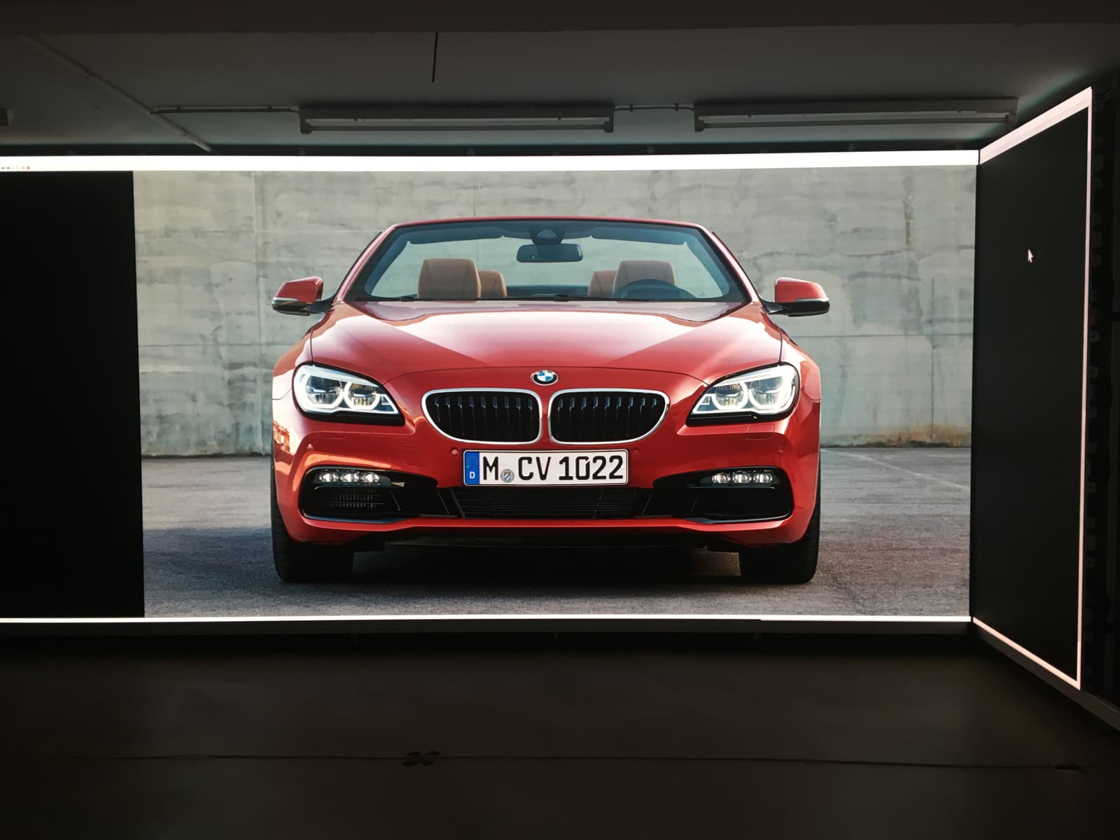 Red BMW convertible rendered at full width on a TRUE dvLED wall in the Kassel studio