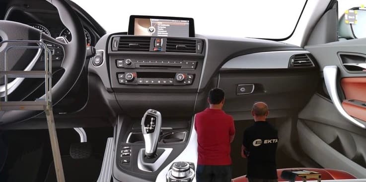 Life size BMW interior on a TRUE dvLED wall with two people standing for scale