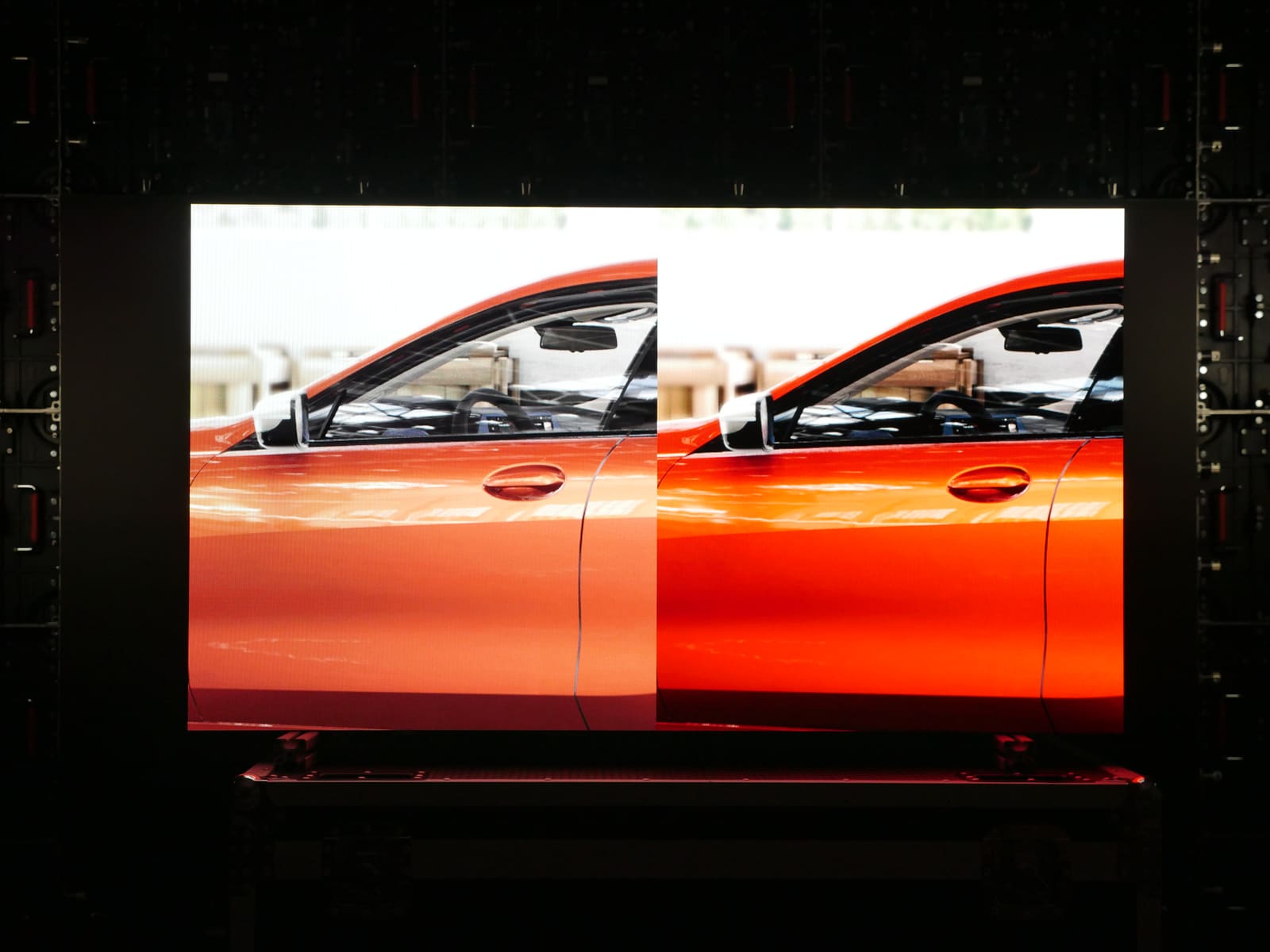 Two views of an orange sports car door compared on a TRUE dvLED wall