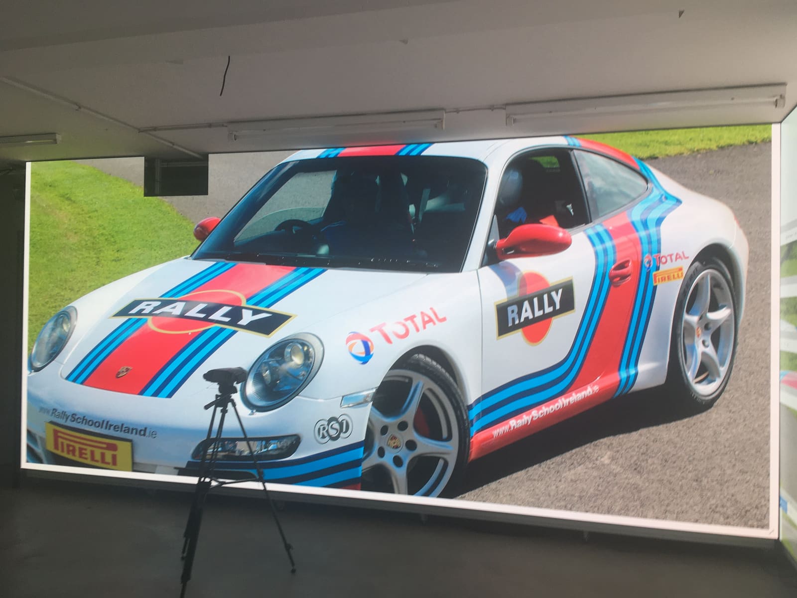 Rally Porsche on a TRUE dvLED wall with a measurement tripod set up in front of it