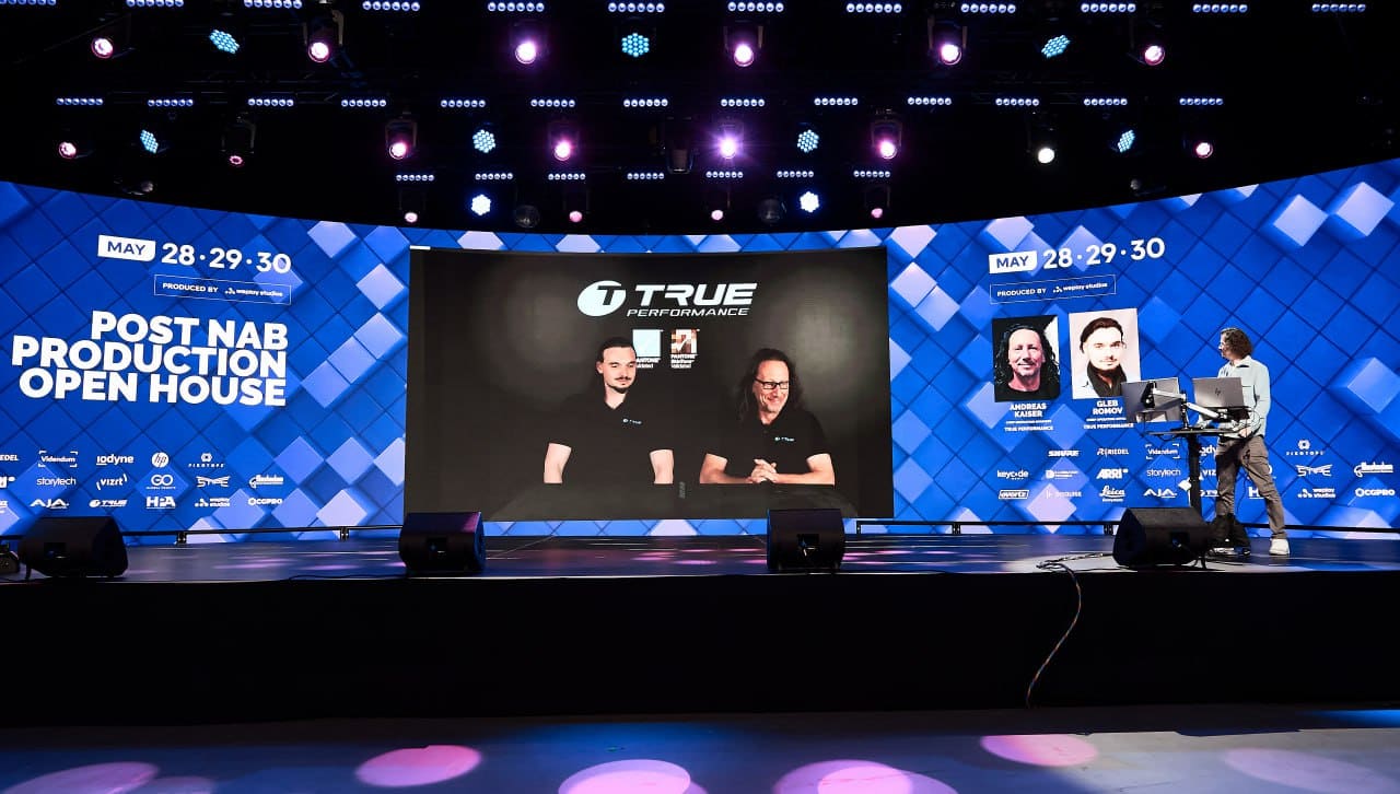 TRUE Performance interview playing on a large curved dvLED event wall
