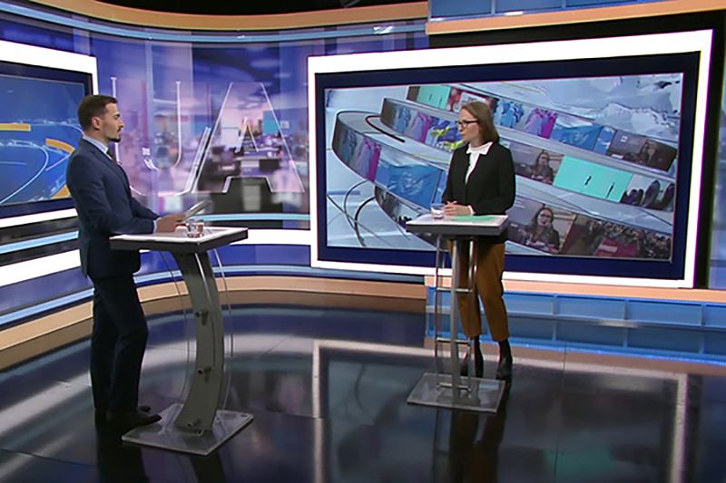 News anchors in front of a TRUE dvLED studio wall
