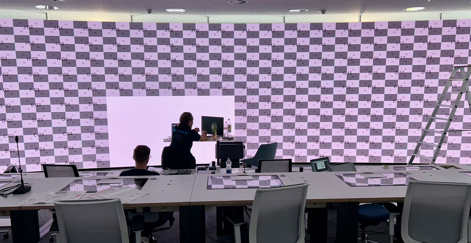 Wide control room TRUE dvLED wall running a checkerboard test pattern during calibration