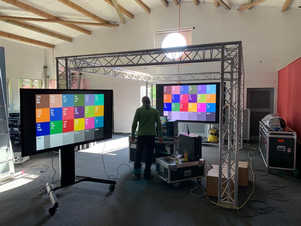 Two TRUE dvLED displays showing color patches with their measured RGB values