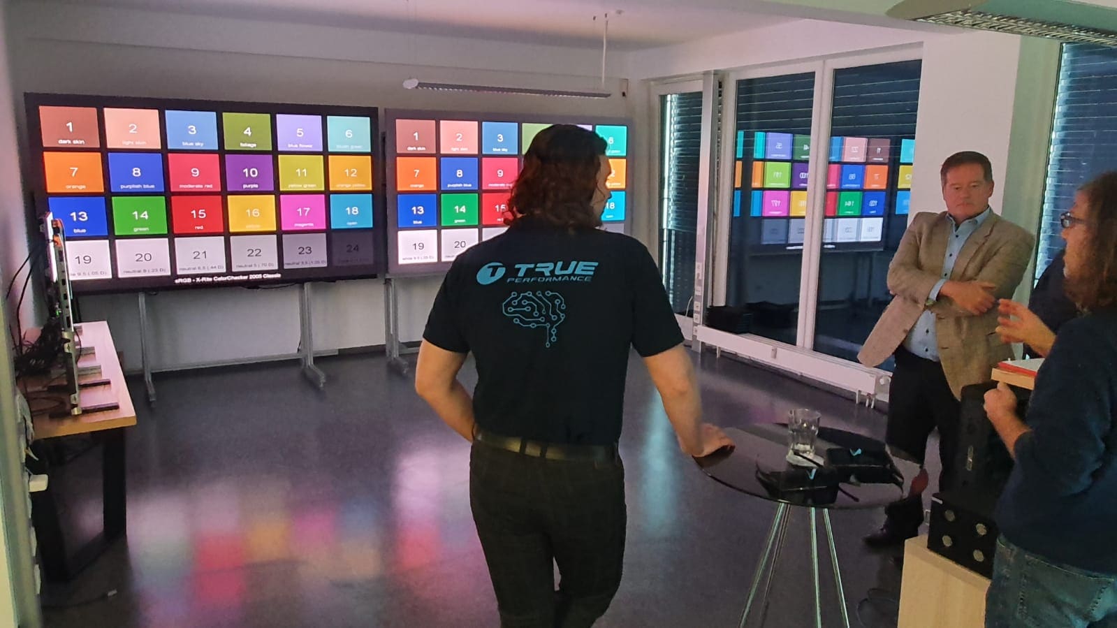 Two TRUE dvLED walls showing color reference charts side by side for visitors