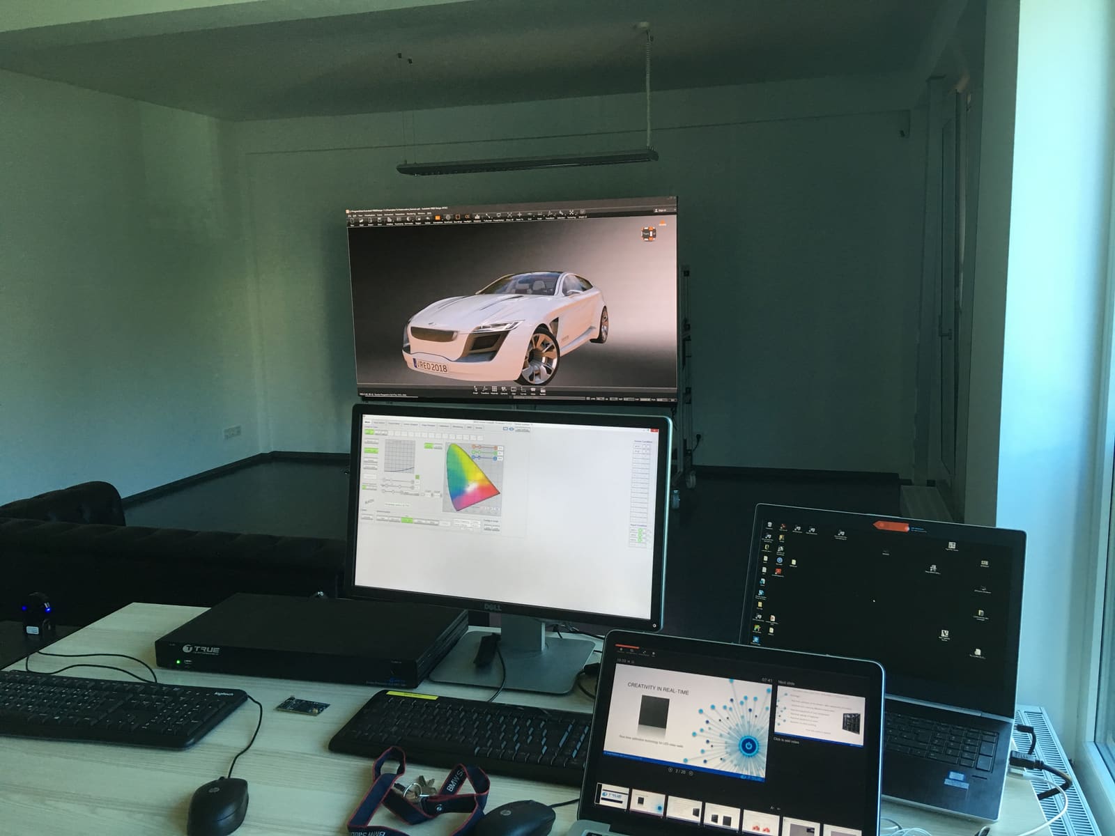 Automotive render on a TRUE dvLED wall beside calibration software and an ERMAC processor