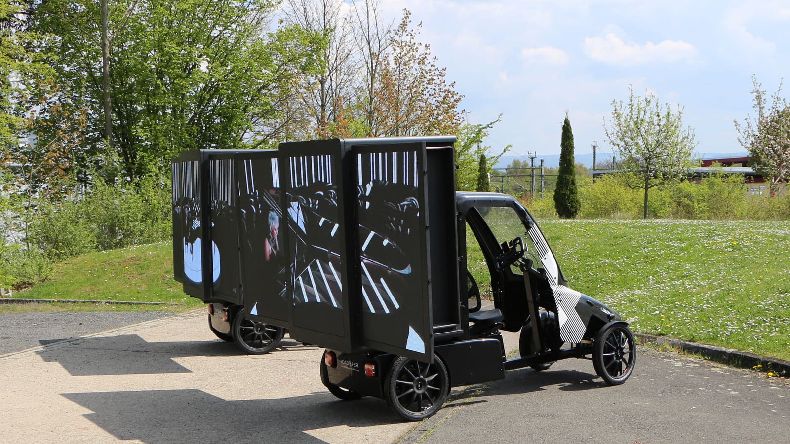 Cargo bike carrying a bright TRUE dvLED panel for mobile out of home advertising