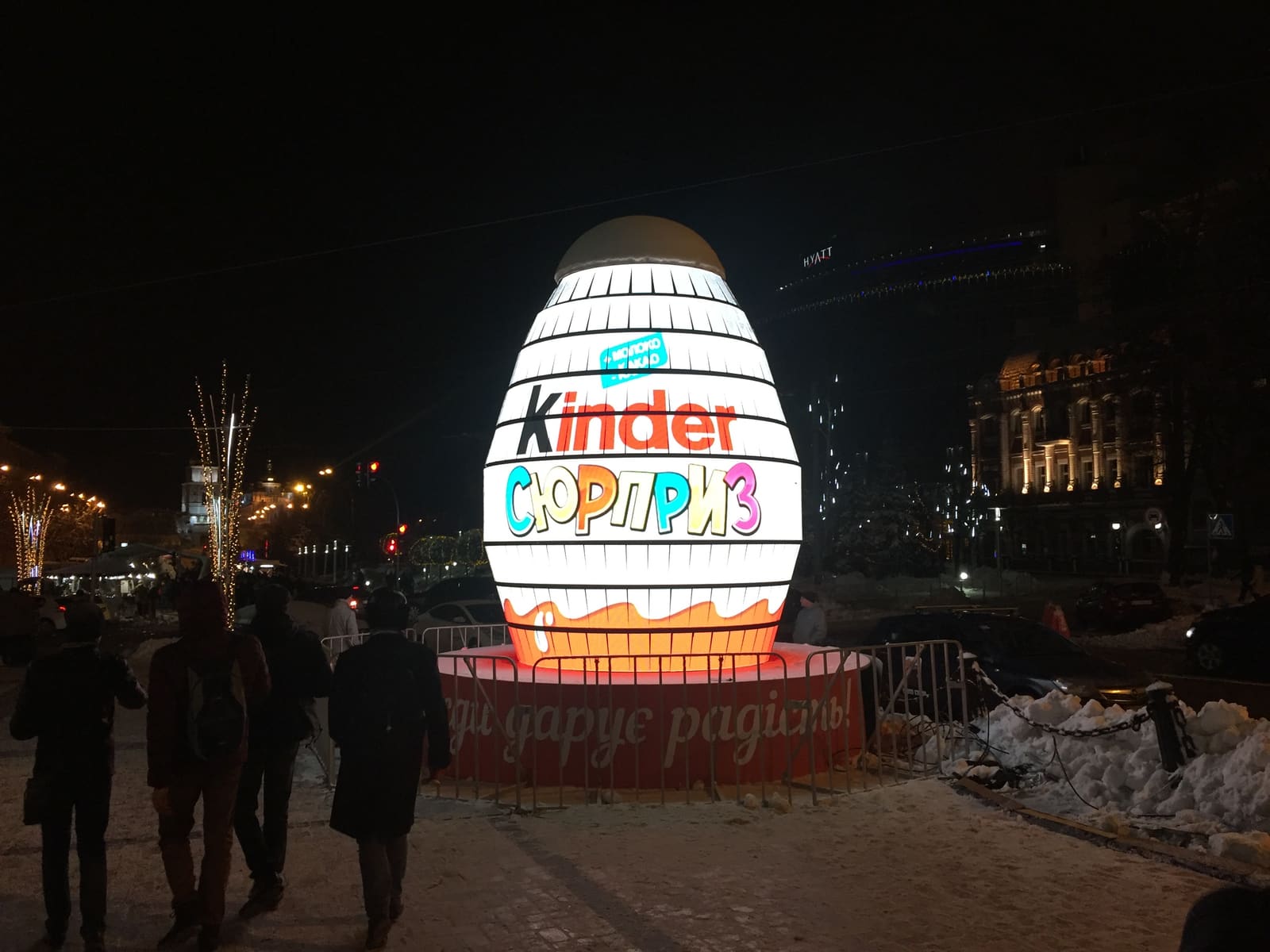Giant illuminated TRUE dvLED egg sculpture in a snowy city square at night