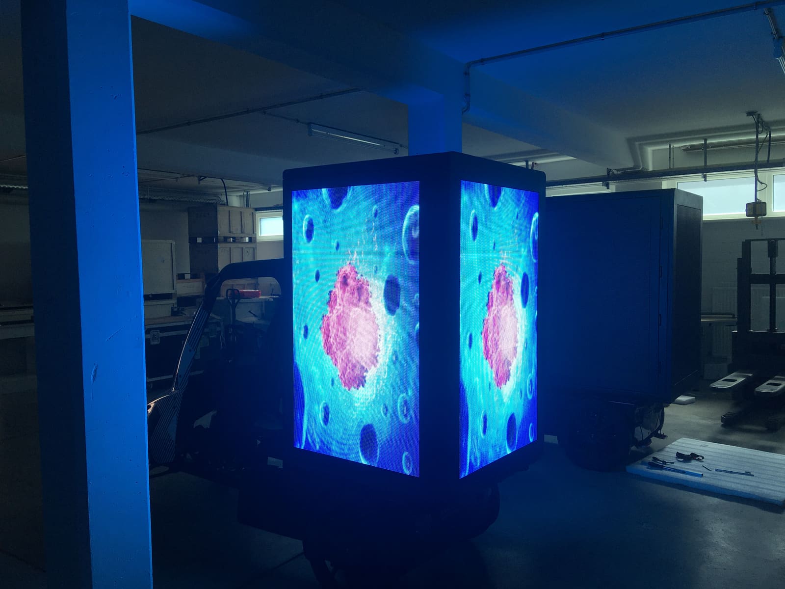 Glowing TRUE dvLED totem cube mounted on a small vehicle