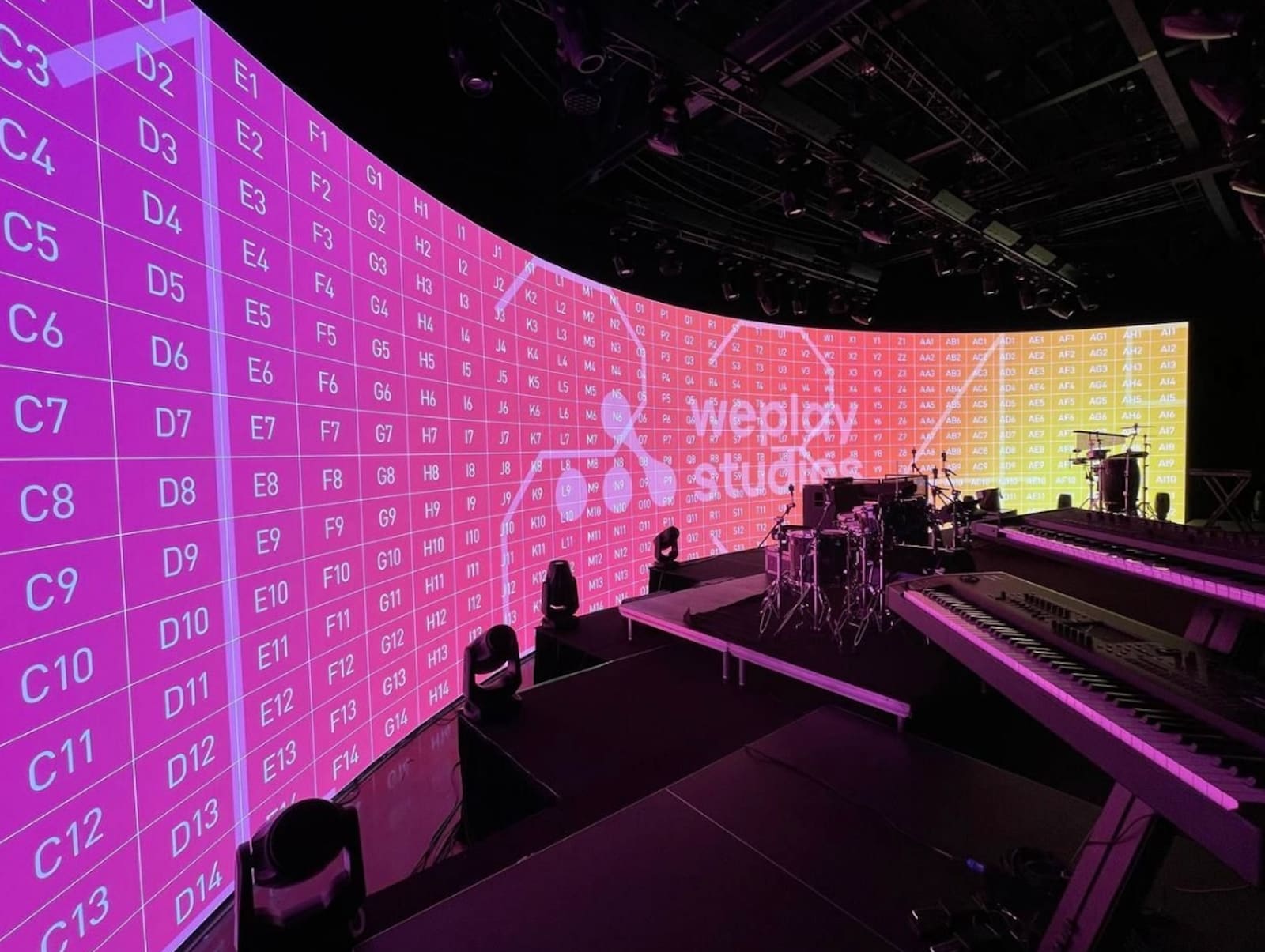 Large curved TRUE dvLED studio wall running a panel mapping grid during commissioning