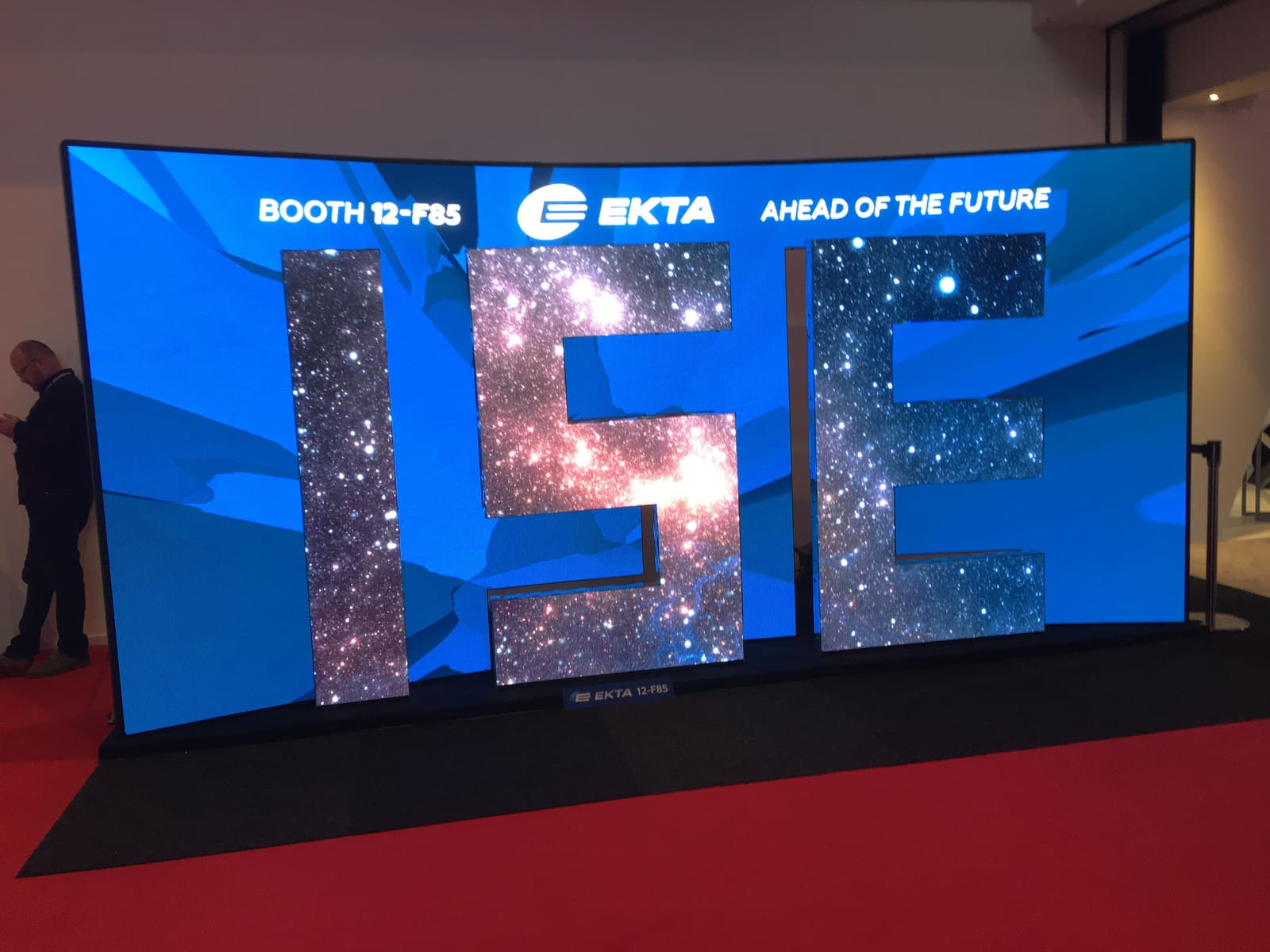 Curved EKTA dvLED wall spelling ISE with starfield content at the trade show