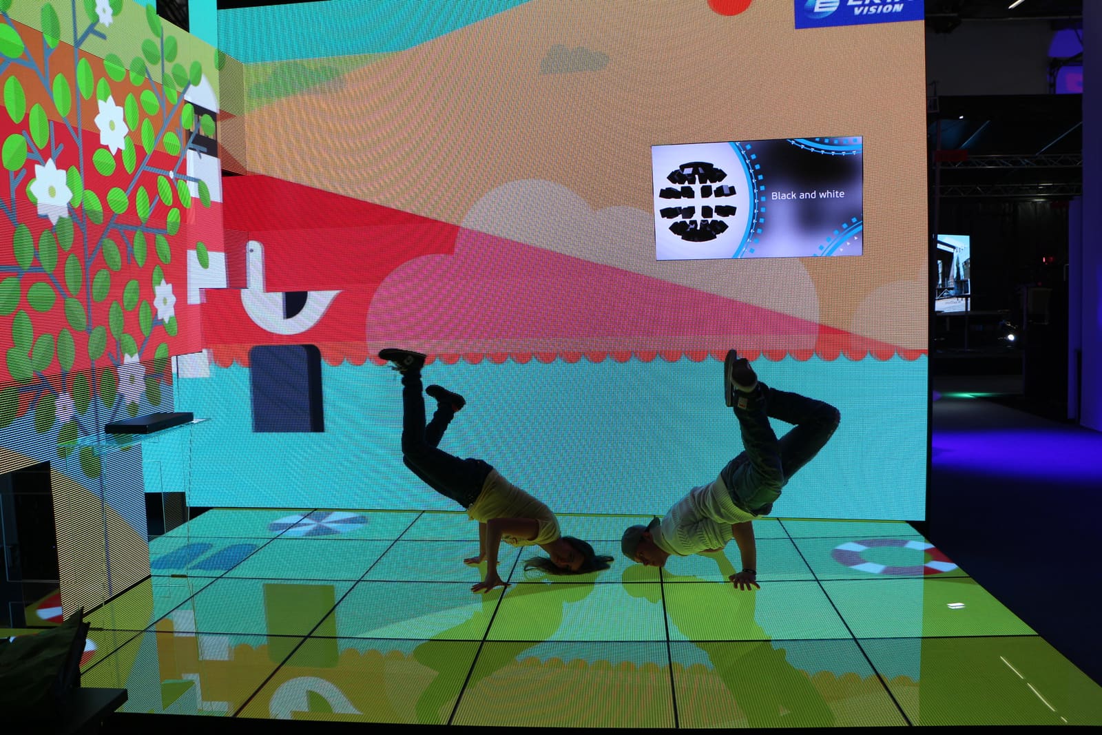 Colorful content on a walkable TRUE dvLED floor at a trade show