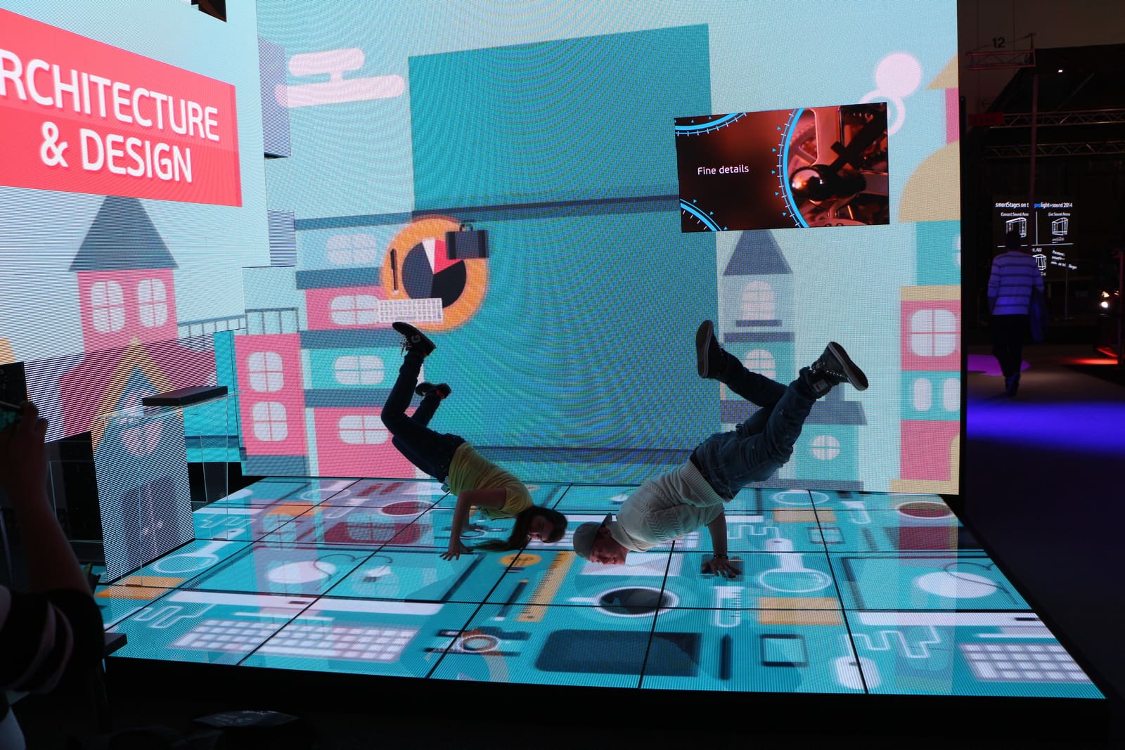 Dancers performing on a TRUE dvLED floor at an exhibition stand