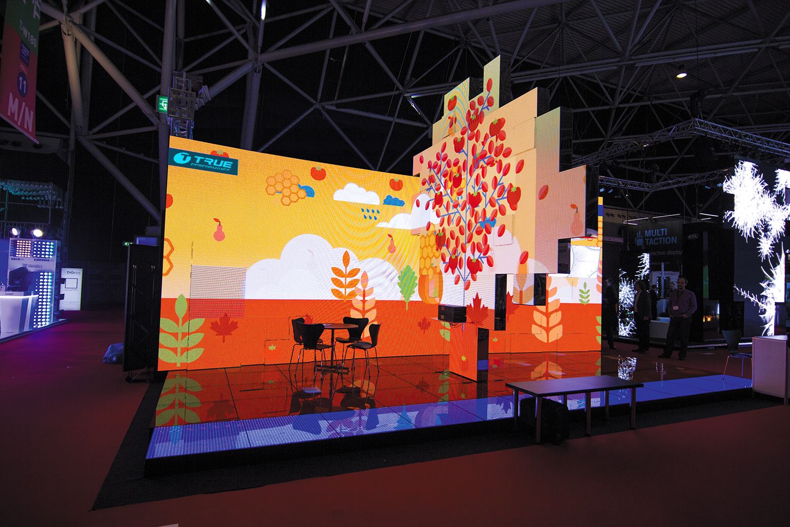 Creative LED tree built from TRUE dvLED panels at a trade show
