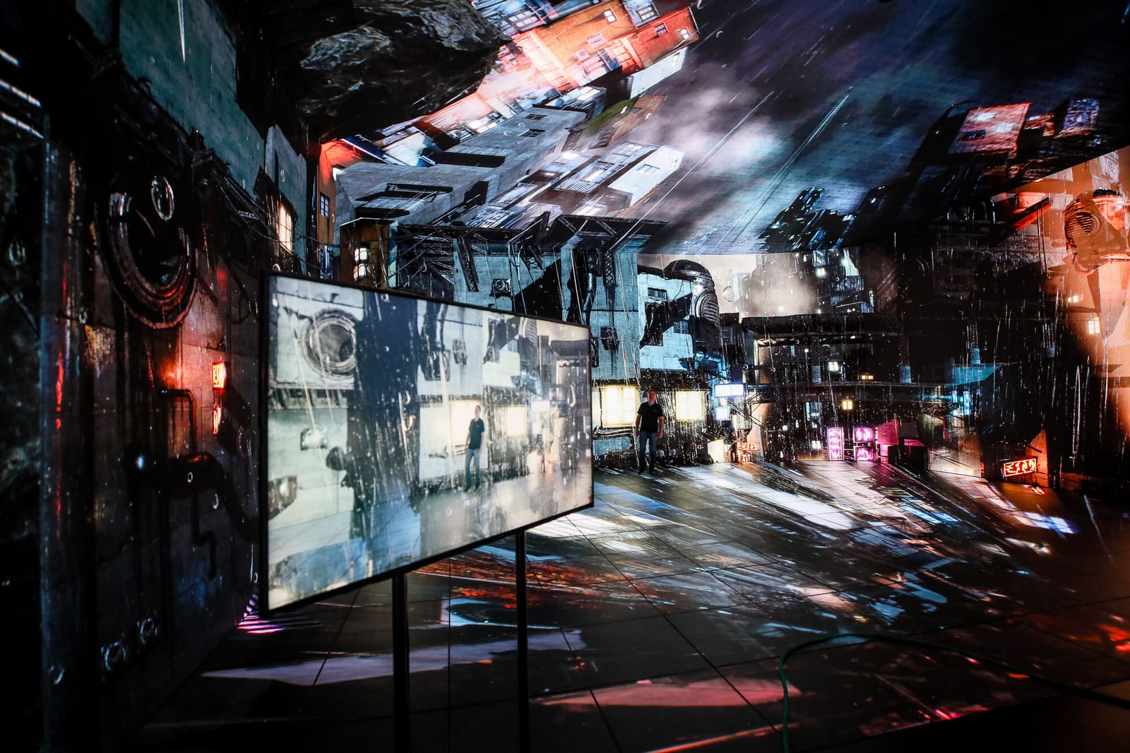 Immersive room wrapped in TRUE dvLED showing a cyber city with reflections on the floor