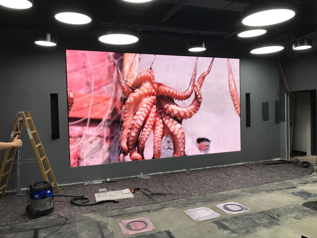 Fine pitch TRUE dvLED wall being commissioned in a modern room