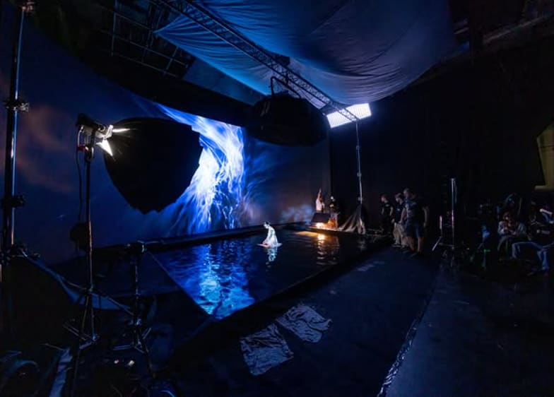 Water tank stage lit blue by a surrounding TRUE dvLED volume