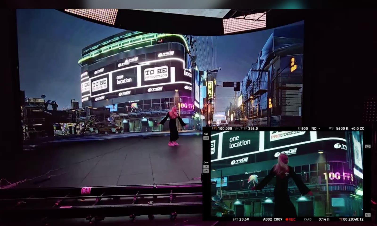 Dancer in a TRUE dvLED volume showing a neon city street, seen through a camera viewfinder